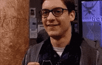 Man With Glasses Smiling Holding Cell Phone GIF