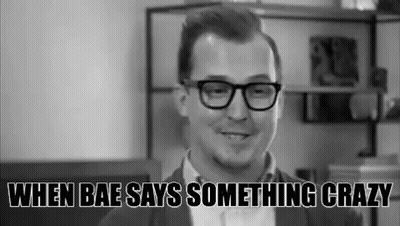 Man With Glasses Smiling In Black And White Photo GIF