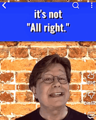 Man With Glasses Smiling In Front Of Brick Wall Saying It's Not All Right On Blue Background GIF