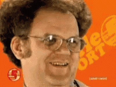 Man With Glasses Smiling In Front Of Orange Background Number 5 GIF