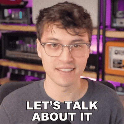 Man With Glasses Smiling Says Let's Talk About It GIF