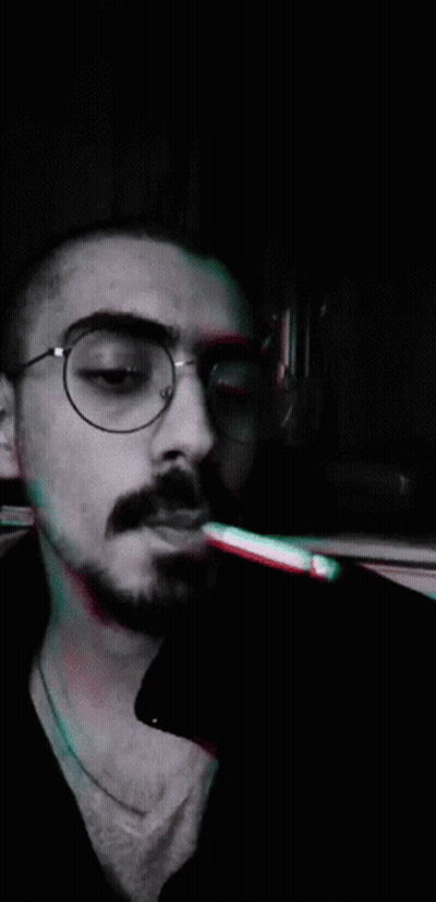 Man With Glasses Smoking Cigarette GIF