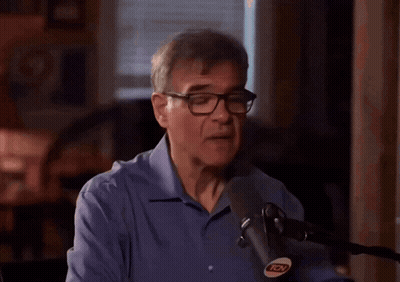Man With Glasses Speaking Into Microphone GIF