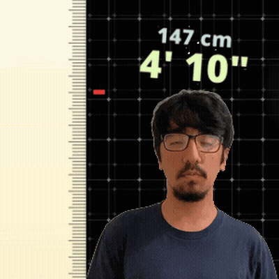 Man With Glasses Standing In Front Of Ruler Reading 147 Cm GIF