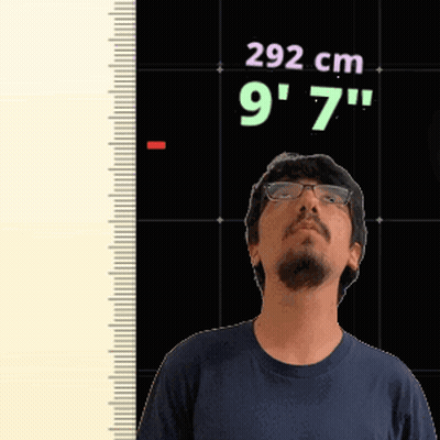 Man With Glasses Standing In Front Of Ruler Saying 292 Cm 9'7 GIF