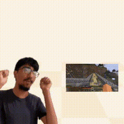 Man With Glasses Standing In Front Of Video Game Picture GIF