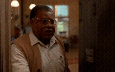 Man With Glasses Standing In Hallway GIF