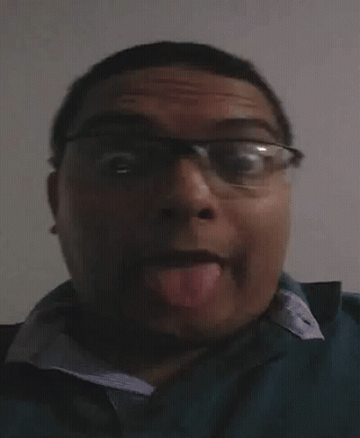 Man With Glasses Sticking Tongue Out GIF