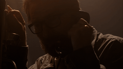 Man With Glasses Talking On Phone Saying Please GIF