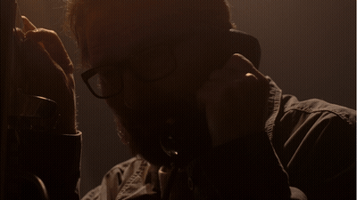 Man With Glasses Talking On Phone Saying Please GIF