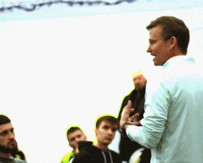 Man With Glasses Talks To Men GIF
