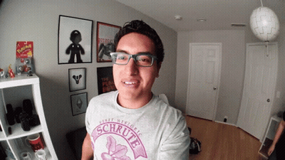 Man With Glasses Wearing Schrutte Shirt GIF