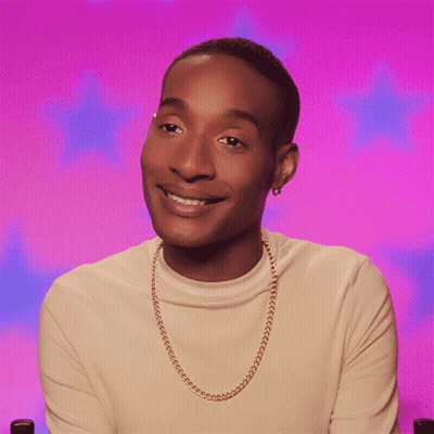 Man With Gold Chain Smiles GIF