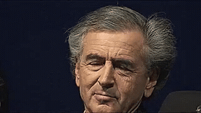 Man With Gray Hair Against Dark Blue Background GIF