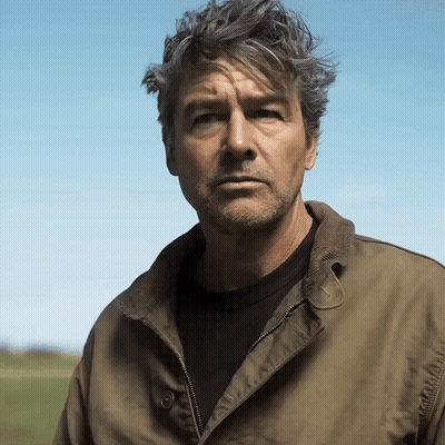 Man With Gray Hair And Beard In Green Jacket GIF