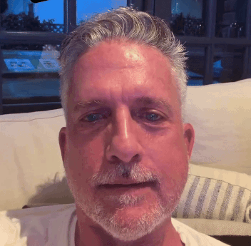 Man With Gray Hair And Beard Sitting GIF
