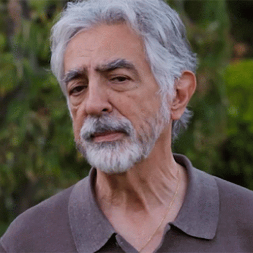 Man With Gray Hair And Beard Wearing Grey Shirt GIF