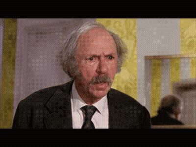 Man With Gray Hair And Mustache In Suit GIF