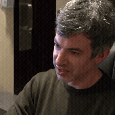 Man With Gray Hair In Black Sweater GIF