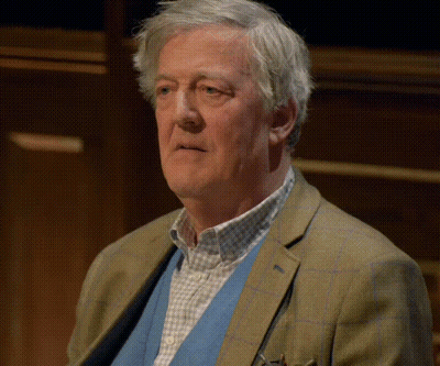 Man With Gray Hair In Plaid Jacket GIF