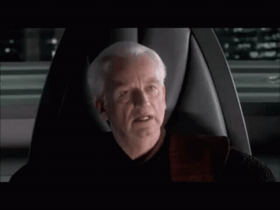 Man With Gray Hair Sitting In Chair Talking GIF