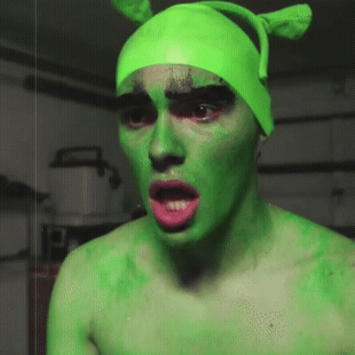 Man With Green Face Paint And Hat GIF