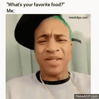 Man With Green Hair Making Funny Face Wearing Hat And Necklace GIF
