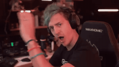 Man With Green Hair Wearing Headphones In Gaming Chair GIF
