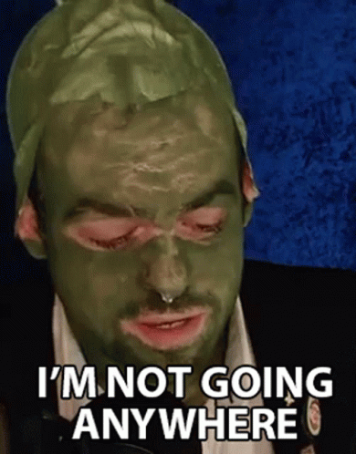 Man With Green Mask Making Funny Face GIF