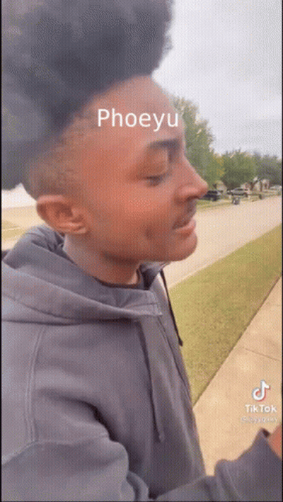 Man With Green Paint On Face And Headphones GIF