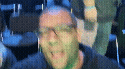 Man With Green Paint On Face Wearing Headphones GIF