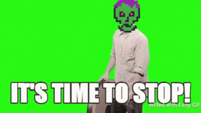 Man With Green Skull Holding Wheel Says Stop GIF