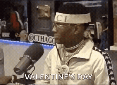 Man With Gucci Headband Sitting At Microphone Talking GIF