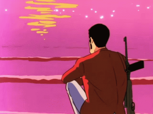 Man With Gun Sitting On Beach GIF