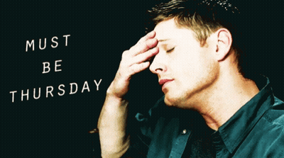 Man With Hand On Forehead In Front Of Must Be Thursday Sign GIF
