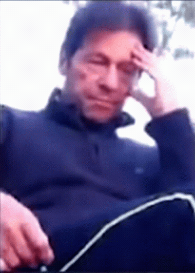 Man With Hand On Forehead Sitting Down GIF