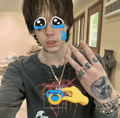 Man With Hand Tattoo Holding Pacifier GIF