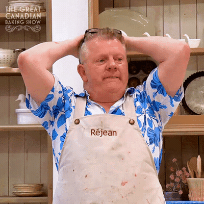 Man With Hands Behind Head Wearing Rejean Apron GIF