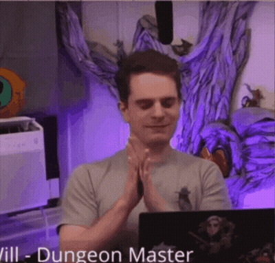 Man With Hands Folded In Front Of Dungeon Master Laptop GIF