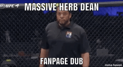 Man With Hands Folded In Front Of Fence Saying Massive Herb Dean Fanpage Dub GIF