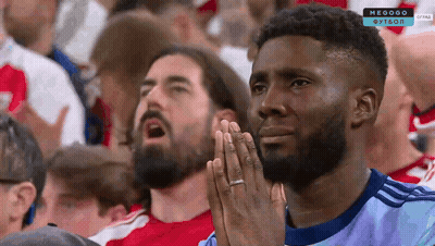 Man With Hands Folded Watching Soccer GIF