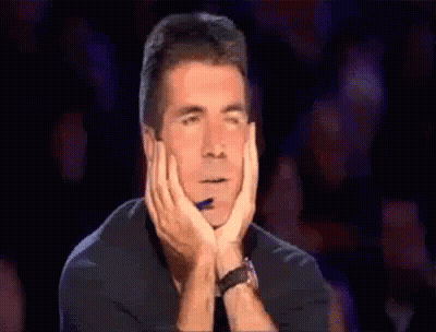 Man With Hands On Face And Pen In Mouth GIF