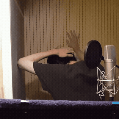 Man With Hands On Head At Microphone GIF