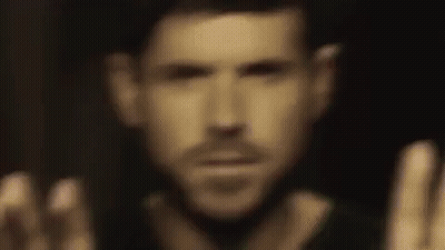 Man With Hands Up In Dark GIF