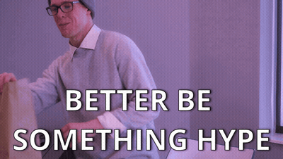 Man With Hat And Glasses Holding Brown Bag Saying Better Be Something Hype GIF