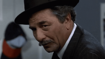 Man With Hat And Mustache Looking Down GIF