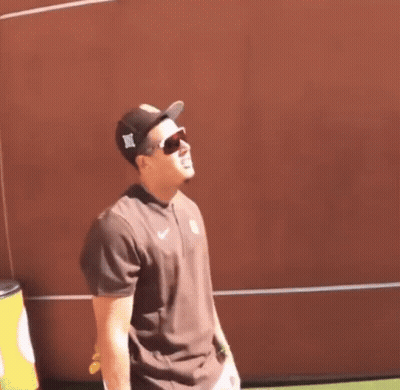 Man With Hat And Sunglasses At Red Wall GIF