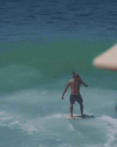 Man With Hat And Sunglasses Looking At Ocean GIF