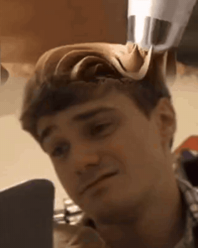Man With Hat Looking At Laptop GIF