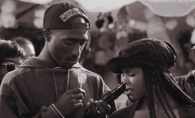 Man With Hat Saying Underground Smoking Beside Woman GIF